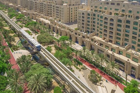 An aerial photo Al-Ittihad Park in Dubai near Palm Monorail's railway